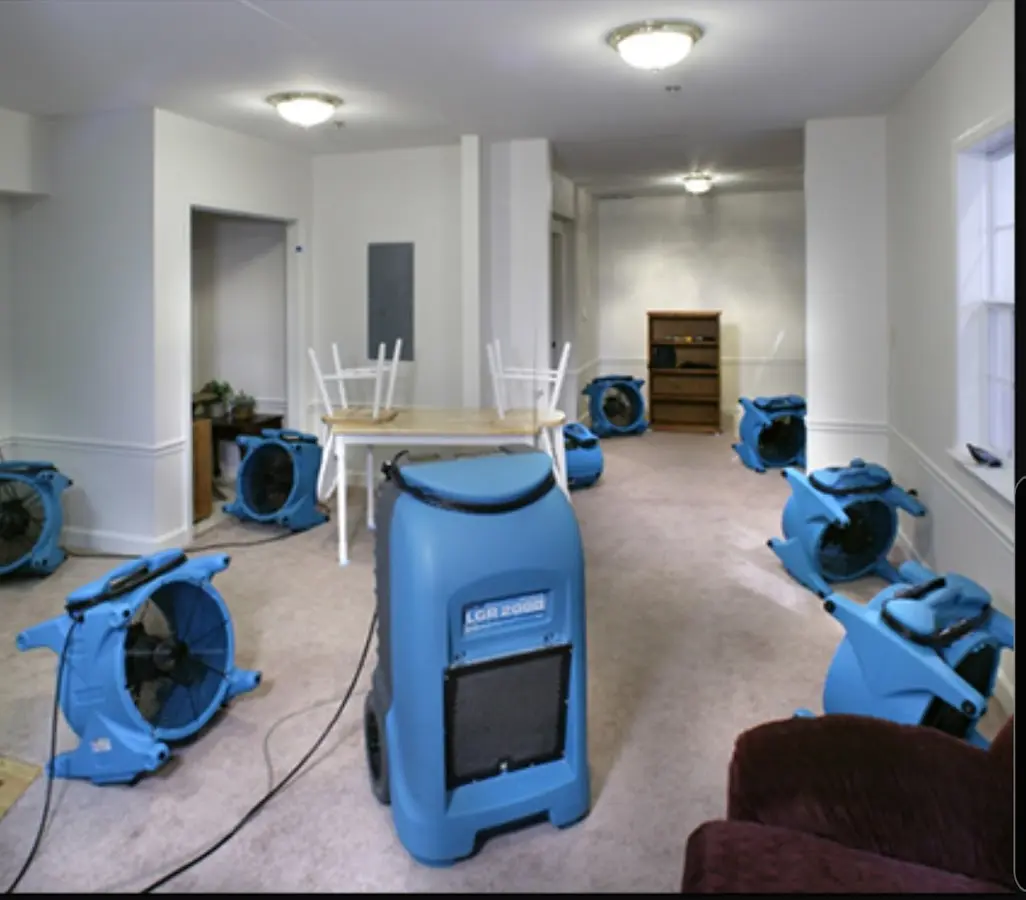 Air movers and dehumidifier setup for Water Damage Restoration in Rusk